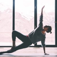 conscious arkane editorial person doing yoga