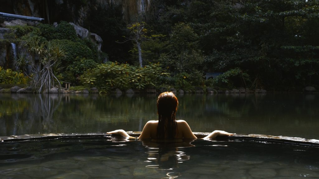 GirlinNatureSpaBali36 Girl in swimming pool surrounded by jungle